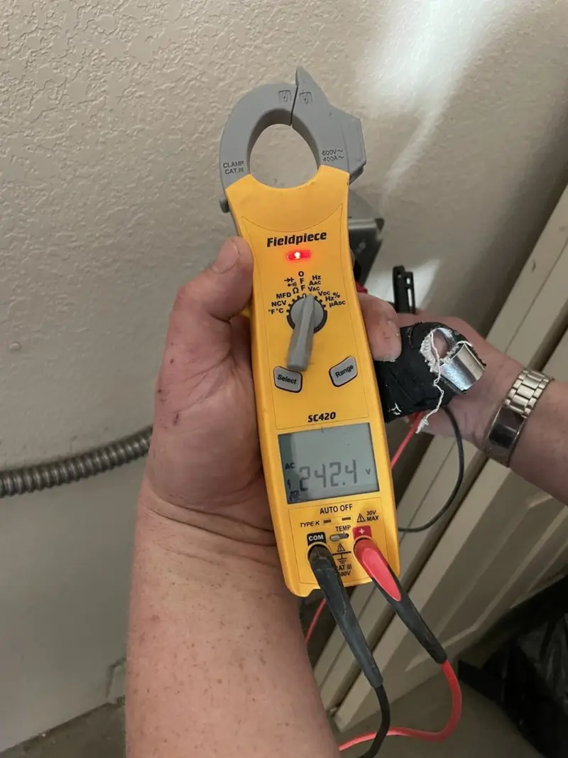 Voltage testing with clamp meter during Generator Installation in Reedsburg